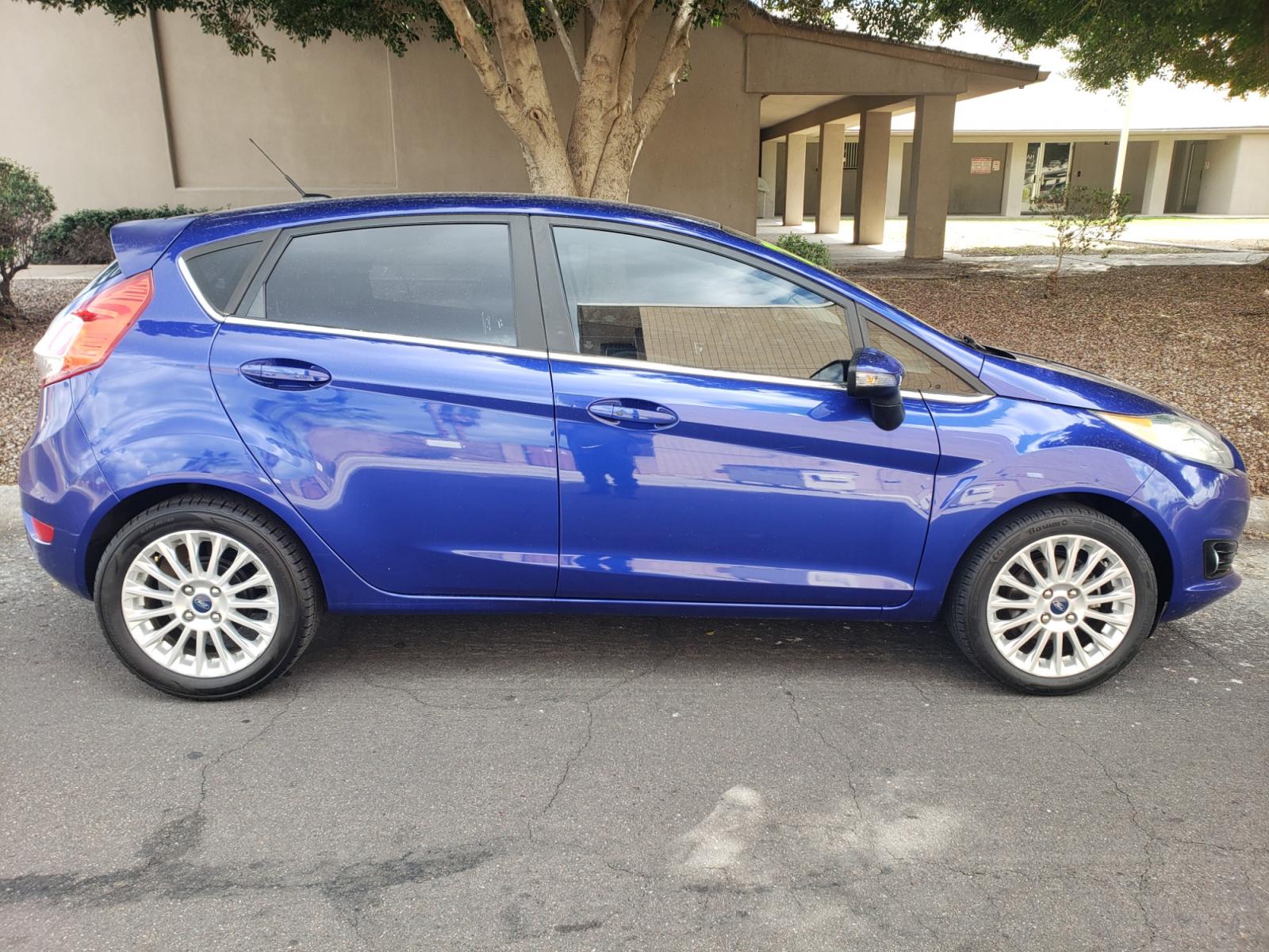 2014 /Tan and black Ford Fiesta Titanium (3FADP4FJ5EM) with an 1.6l i4 engine, 6-Speed Automatic transmission, located at 323 E Dunlap Ave., Phoenix, AZ, 85020, (602) 331-9000, 33.567677, -112.069000 - 2014 Ford Fiesta Titanium,.......A Must See!!... No accidents, Only 95K MILES.... Ice cold AC. The car is gorgeous inside and out. Power windows, Power door locks, Touch screen Stereo/ CD Player, Phone sync, Bluetooth, Satellite compatible, Backup camera, Beautiful tan and black interior with tan le - Photo #4